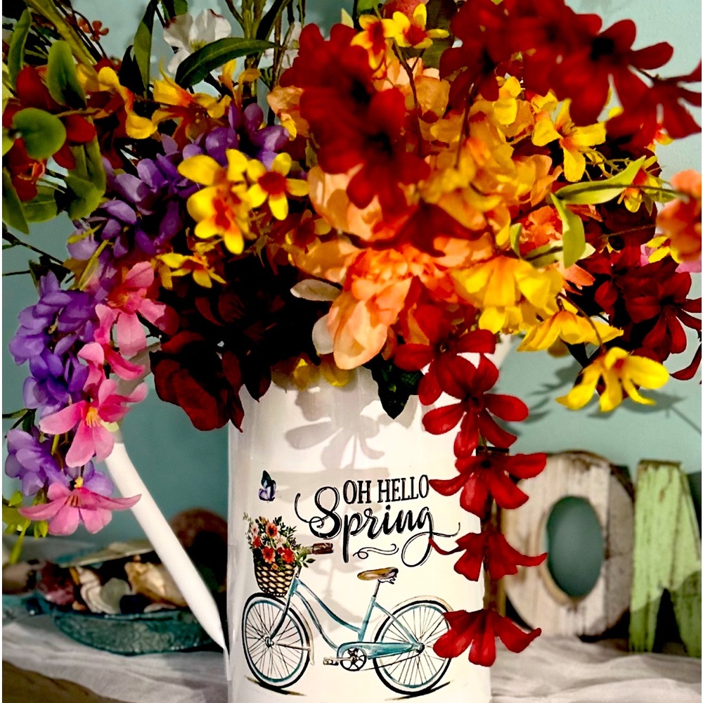 Watering can spring arrangement